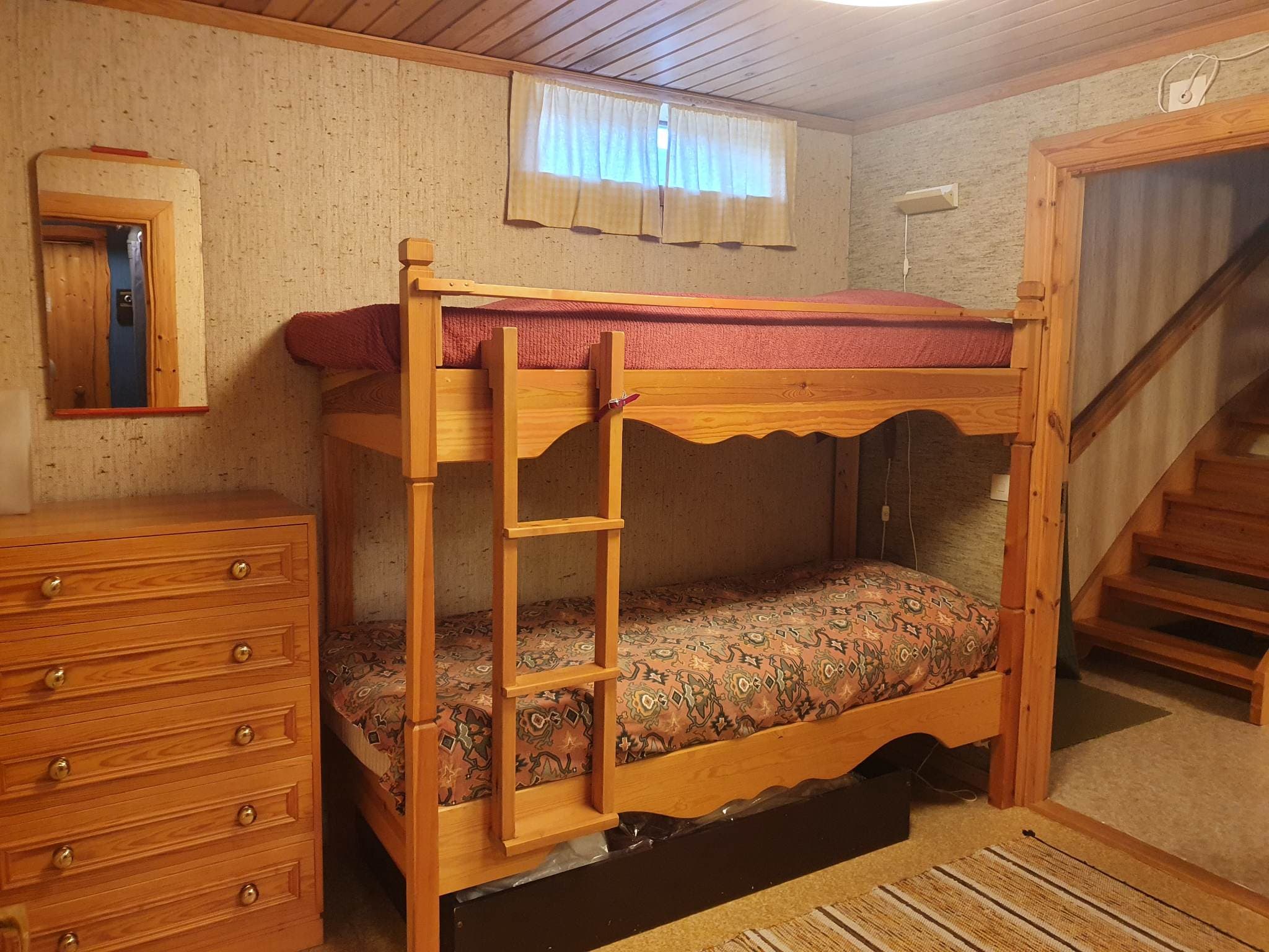 The bedroom in the basement with bunk bed other angle